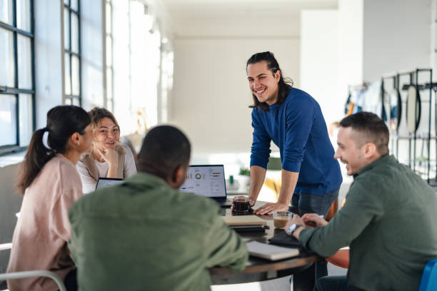 istock Diverse Group of Students Collaborating in a Bright Office Space 2168660379