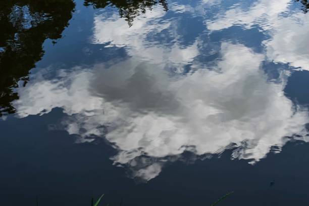 istock Blue skies with cotton clouds 2168662115