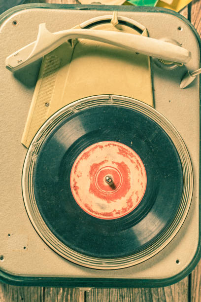 istock Retro record player with few scratched vinyl records. 2168666230