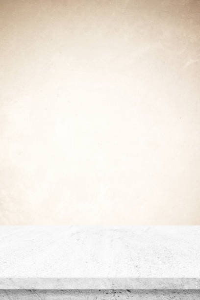 istock Empty white marble table over brown cement wall background, vertical banner, product display montage backdrop 2168668983