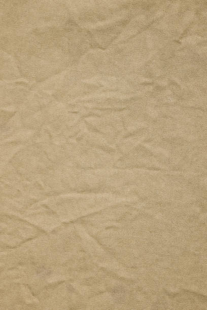 istock Brown cotton fabric texture background, Wrinkle surface textile, wallpaper, banner, vertical 2168669054