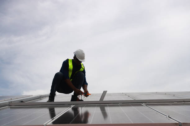 istock The black male Solar energy systems engineer performs analysis of solar panels  at the solar farm 2168669449