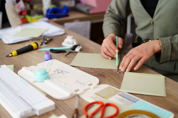 istock Small business owner making wedding invitation cards while working in her flower shop 2168671496