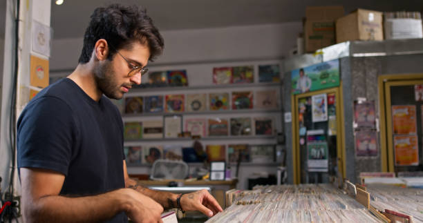 Man hand selecting vinyl records