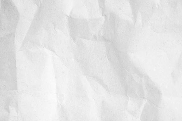 istock White recycled craft paper texture as background. Grey paper texture, Old vintage page or grunge vignette of old newspaper. Pattern rough art creased grunge letter. Hardboard with copy space for text. 2168676541
