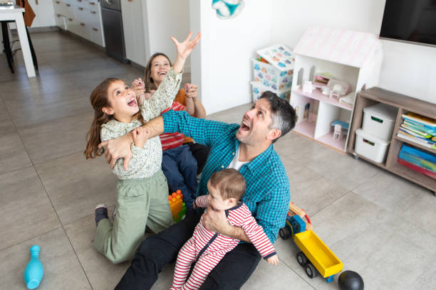 Excited Family Explore New Home On Moving Day