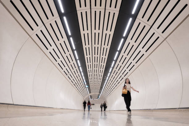 The new Martin Place Metro as part of these new Sydney Metro network opened in August 2024. Showing the interior of the station. It's expansive, well-lit spaces are defined by angular, geometric structures and a minimalist aesthetic, creating a sense of order and efficiency