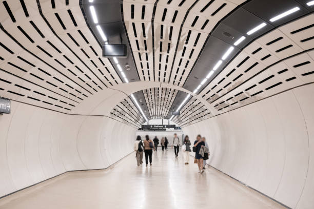 istock Obscured Inner city commuters walking through a futuristic tunnel as an example of fast pace life 2168687462