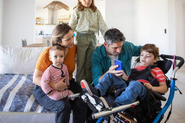 istock Portrait of parents with three small children using technology at home 2168687627