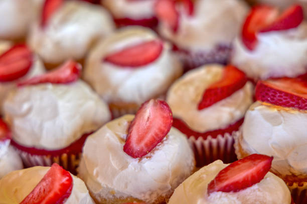cup cake, muffin with fresh strawberry , frosty icing glazing