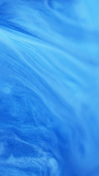 istock Paint spill fluid art blue glitter acrylic flow 2168699388