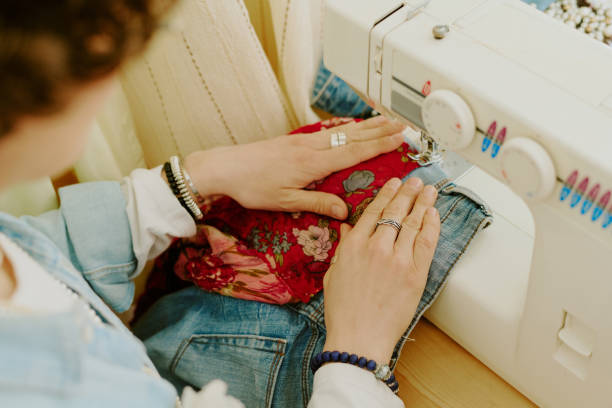 Sewing Fabric with Hands Near Sewing Machine