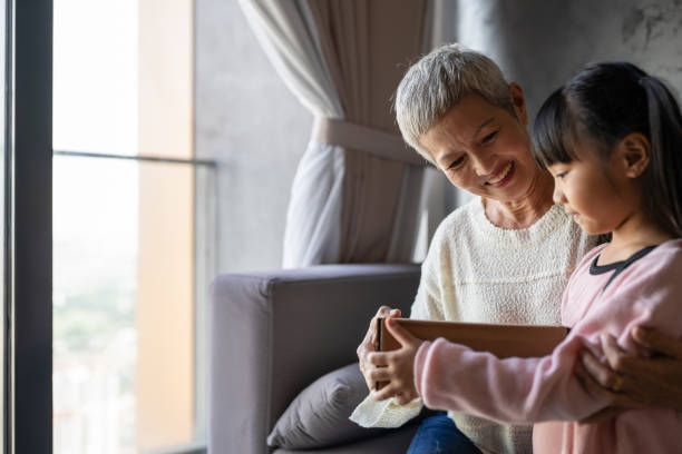 istock Present exchange between grandma and granddaughter 2168705444