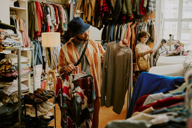 istock Shopping for Clothes in Vintage Thrift Store 2168705927