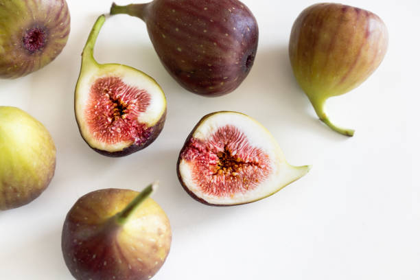 istock Fresh figs. A few fig halves on a white background 2168711699