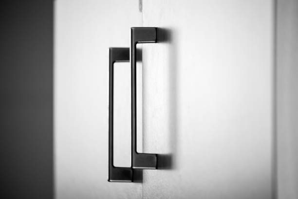istock cupboard door handles, office environment detail. 2168717404