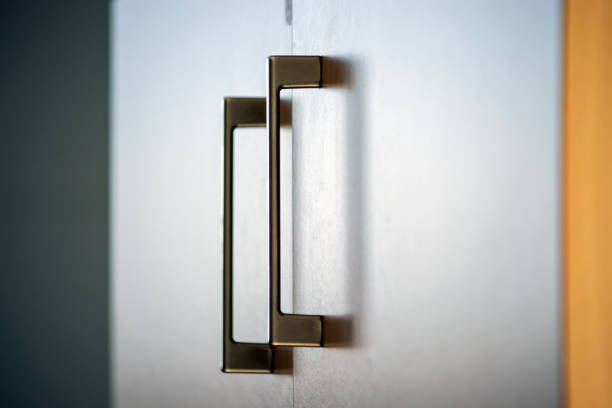 cupboard door handles, office environment detail.