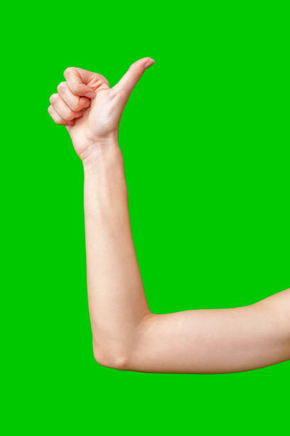 istock Woman's Hand Gesturing Thumbs Up Against Green Screen 2168719063