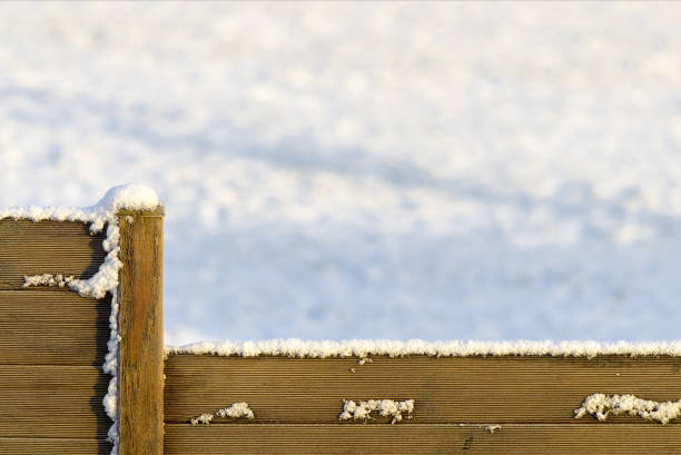 istock wooden board and snow 2168723462