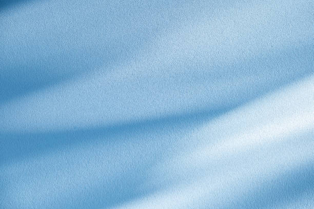 Studio style background wall decoration presentation uses white and blue tones. with shadows cast from a nearby window, concept creating a decorative