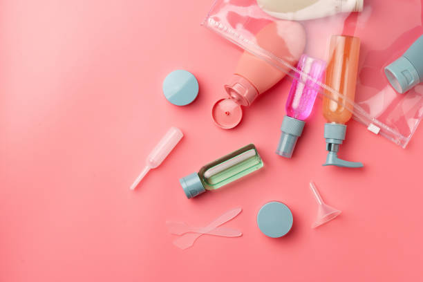 istock Clear Plastic Bag Containing Travel-Sized Toiletries on Pink Background 2168726420