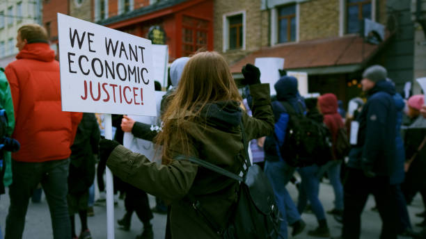istock Crowd walk we want economic justice placards. Inflation protest. Crisis banner. 2168731433