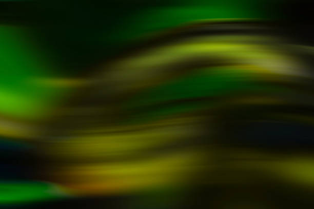 Abstract texture with flowing dark green and yellow wave patterns on a black background Abstract texture with flowing dark green and yellow wave patterns on a black background