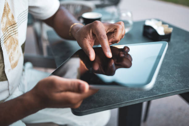 istock African American Businessman analyzing financial statistics on tablet 2168733769