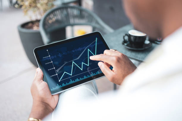 istock Businessman examining financial chart on tablet 2168733913