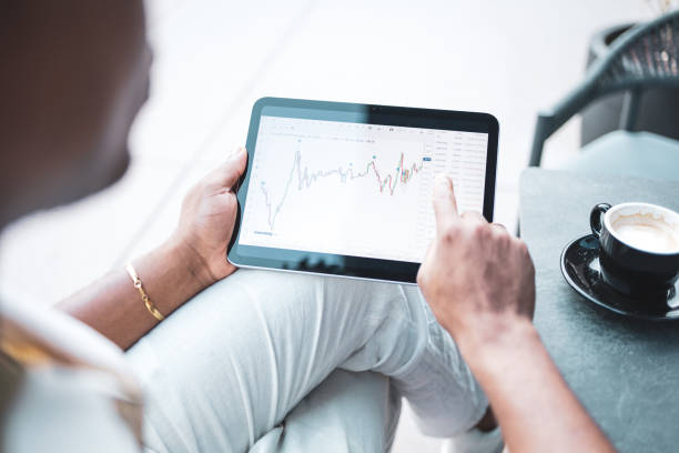 istock Businessman checking the stock market while drinking morning coffee 2168734029