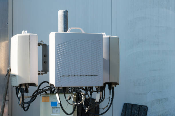 istock Telecommunication equipment mounted on a black wall at an industrial site 2168736949