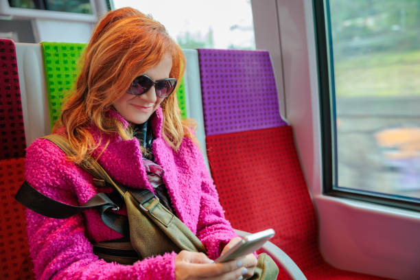 istock Woman in train texting with chatbot on her mobile phone 2168737609