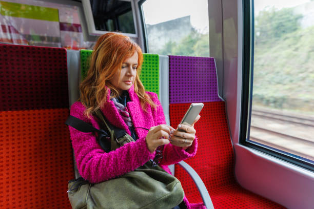 istock Woman in train using chatbot on her smart phone 2168737690