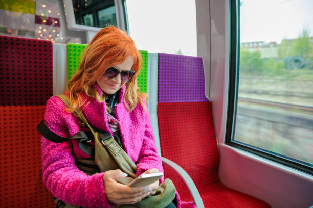 istock Woman in train texting with chatbot on her smart phone 2168737713