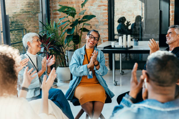 istock Colleagues clapping and praising during a team workshop 2168738856