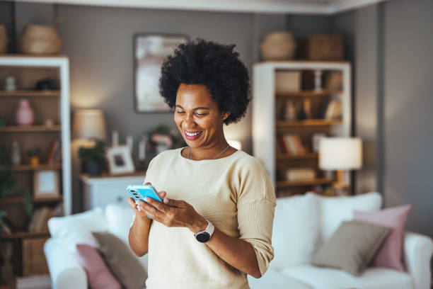 istock Young woman using the mobile phone at home. 2168743399