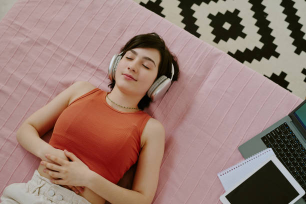 istock Relaxing While Listening to Music on Headphones 2168744729