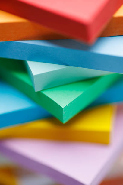 a stack of coloured pads with sticky notes