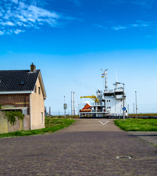 Ship leaving the locks, seen from the street side. Here in IJmuiden are housing and harbor very close together.
