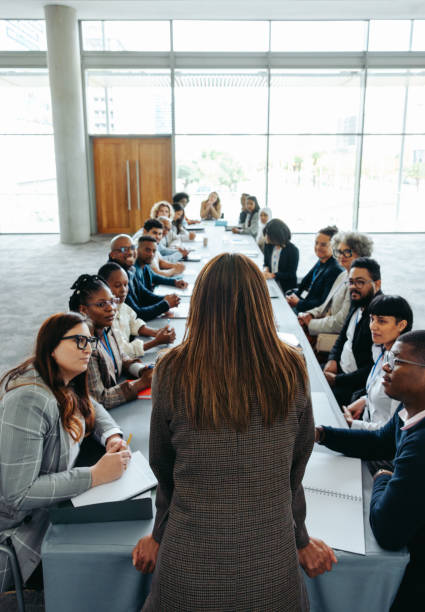 istock Empowered woman leading a diverse group meeting in a modern office setting 2168751056