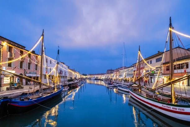 Christmas lights decorate the traditional boats in Cesenatico, a port town and a tourist destination on the Italian Adriatic coast