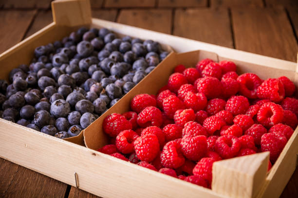 istock Wooden crate filled with blueberries and raspberries 2168752150