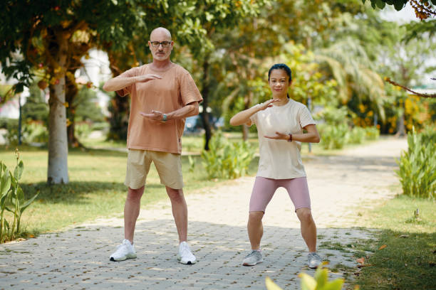 istock Practicing Morning Tai Chi in Lush Green Park Setting 2168754659