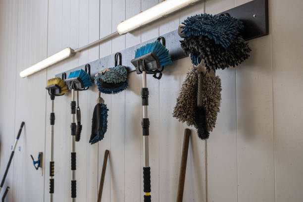 Cleaning tools for washing car hanging on a wall in self garage