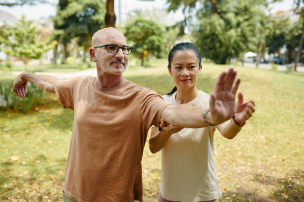 istock Practicing Tai Chi in Tranquil Park Setting Outdoors 2168755093