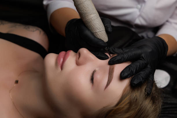 istock Permanent eyebrow makeup, eyebrow tattooing with brown pigment for PMU. 2168755491
