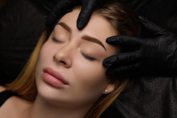 istock Permanent eyebrow makeup, eyebrow tattooing with brown pigment for PMU. 2168756127