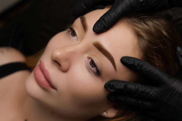 istock Permanent eyebrow makeup, eyebrow tattooing with brown pigment for PMU. 2168756144