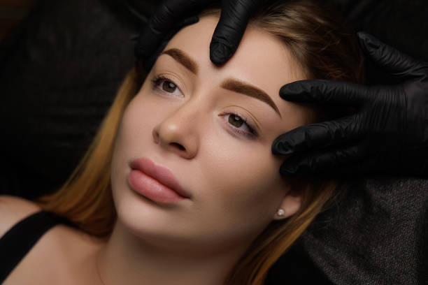 istock Permanent eyebrow makeup, eyebrow tattooing with brown pigment for PMU. 2168756164