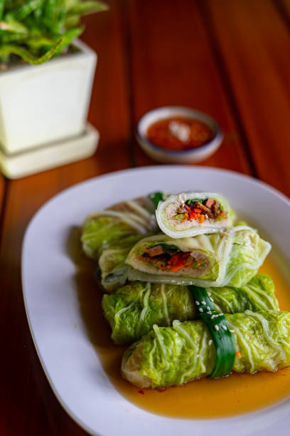 istock Close-up the steamed cabbage with minced meat roll serving on the white plate 2168762555